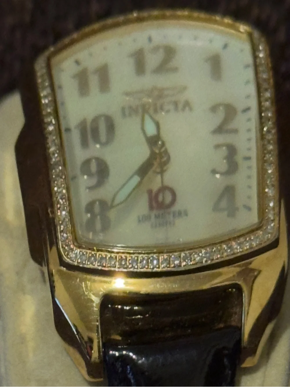 Invicta Women’s Gold-Tone Diamond Accent Watch with White Dial and Brown Strap.